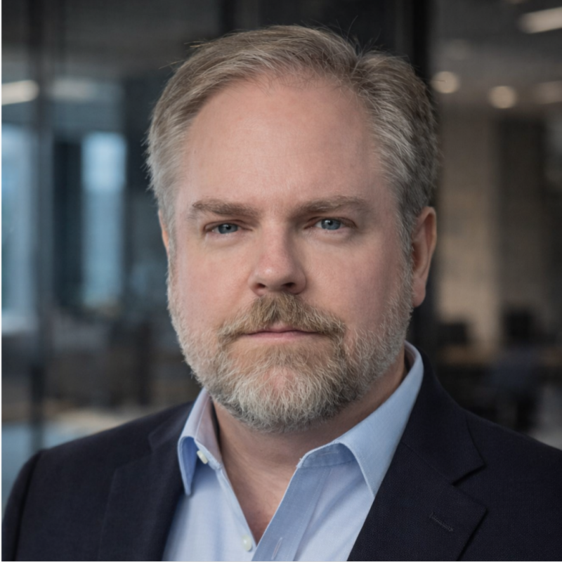 Professional headshot of Greg Crowley